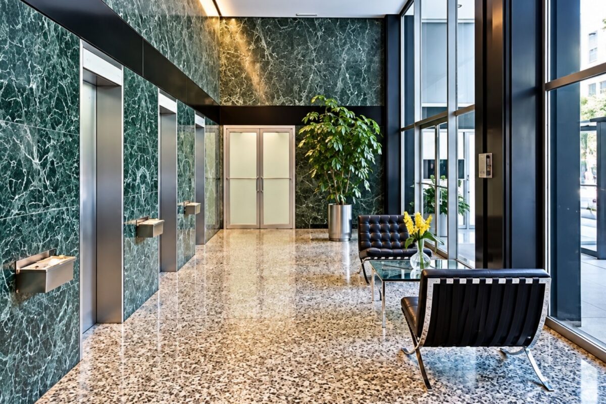 Lobby at 900 Lake Shore Drive, Chicago with green marble walls. The kind of building impacted by Protecting Renters Ordinance