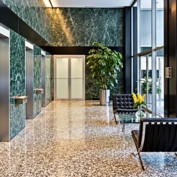 Lobby at 900 Lake Shore Drive, Chicago with green marble walls. The kind of building impacted by Protecting Renters Ordinance