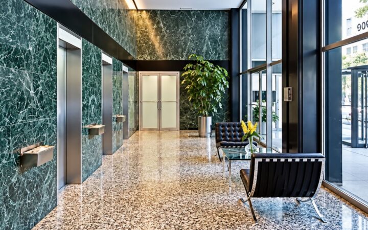 Lobby at 900 Lake Shore Drive, Chicago with green marble walls. The kind of building impacted by Protecting Renters Ordinance