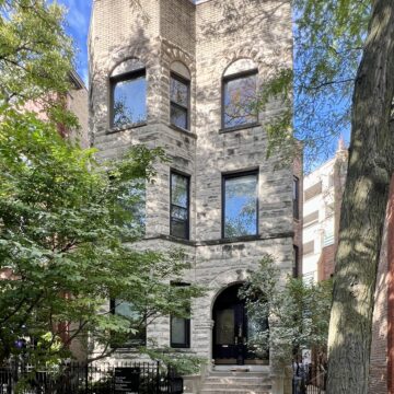 3 story greystone building in Lincoln Park with clear skies