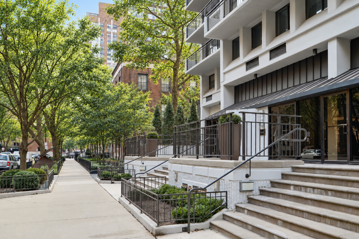 gold coast street with condo buildings and tree-lined sidewalks in Chicago