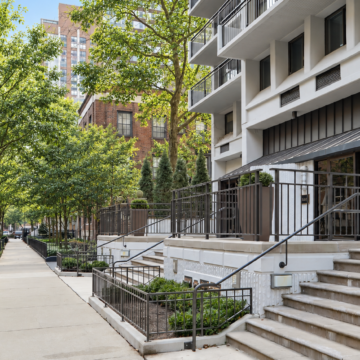 gold coast street with condo buildings and tree-lined sidewalks in Chicago